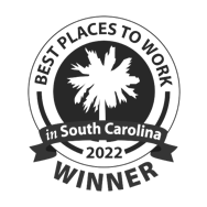 Circular badge with a palm tree silhouette in the center. Text around the edge reads Best Places to Work in South Carolina 2022 Winner. A banner with in South Carolina crosses the lower part, highlighting JEAR Logistics as a proud recipient.