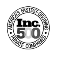 A circular black and white badge featuring JEAR Logistics, with the text Americas Fastest-Growing Private Companies around the edge and Inc. 500 in bold at the center.