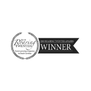 Black and white logo featuring a laurel wreath with JEAR Logistics, 2019 Roaring Twenties, and Fastest-growing companies in South Carolina. A ribbon on the right reads 2019 Roaring Twenties Awards WINNER.