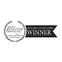 Black and white logo with laurel wreath reading 2019 Roaring Twenties, fastest-growing companies in South Carolina, and a banner stating 2019 Roaring Twenties Awards WINNER.