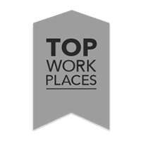 A gray ribbon-shaped badge with the words Top Work Places in bold black letters, stacked vertically in the center.